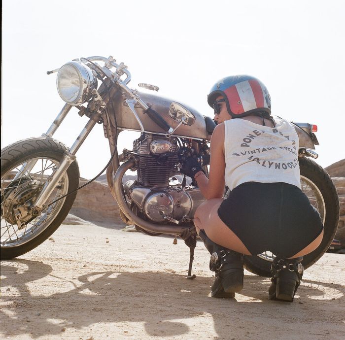 A playful frame from Girls on a motorcycle — online in Shenyang